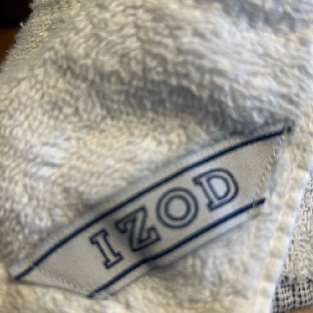 2 sports towels. 1 is reversible and has a tennis player. 1 is izod brand.